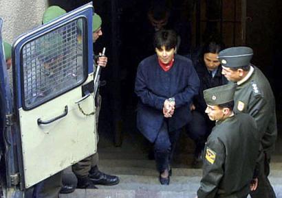 Former Kurdish deputy Leyla Zana, handcuffed gets ready to enter a van after her retrial at a State security court in Ankara, Turkey, Friday, March 28, 2003. Zana is being retried together with three other Kurdish politicians. Zana was originally sentenced to 15 years in prison for collaborating with an outlawed Kurdish group fighting for autonomy in Turkey's southeast. (AP Photo/Nuri Kaynar, Anatolia )